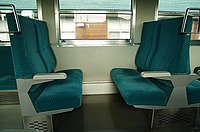 green, floor, indoor, chair, train, room, seat, interior, bus, vehicle, couch, area, furniture